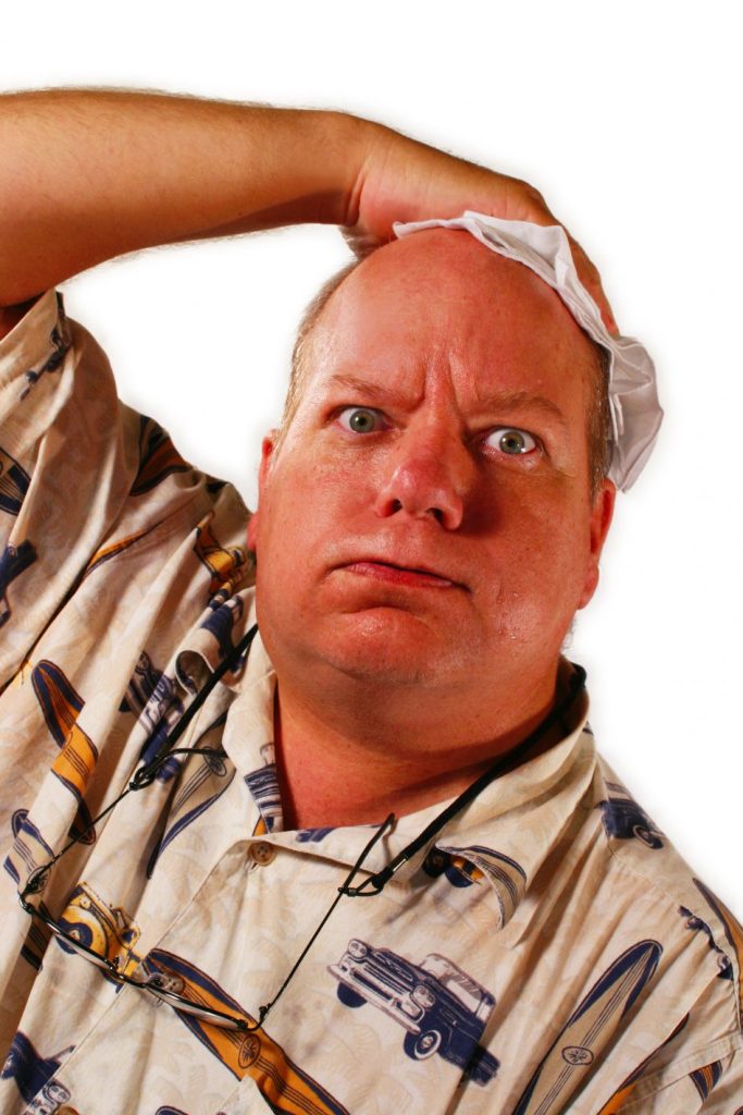 Overheated overstressed middleaged man wipes his head