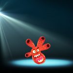 Abstract image of concert lighting against a dark background with cartoon bacteria character