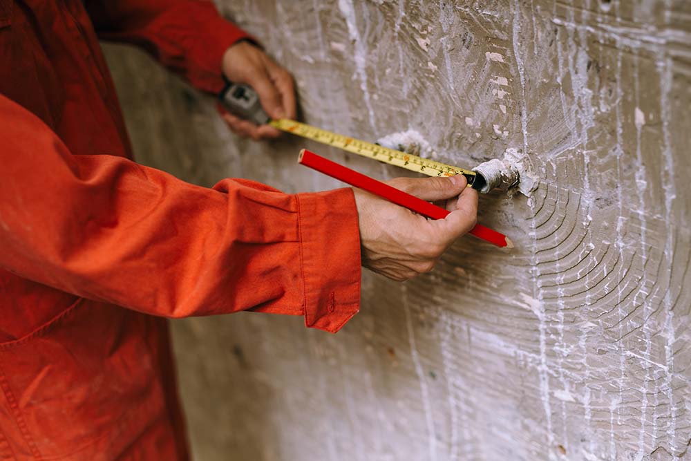 technicians making measurements in an installation area