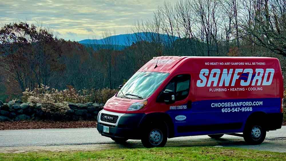 Sanford Temperature Control technician in a vehicle for a service call