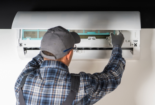 Hvac Technician Repairing Air Conditioning