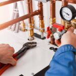 technician tinkering with a heating system